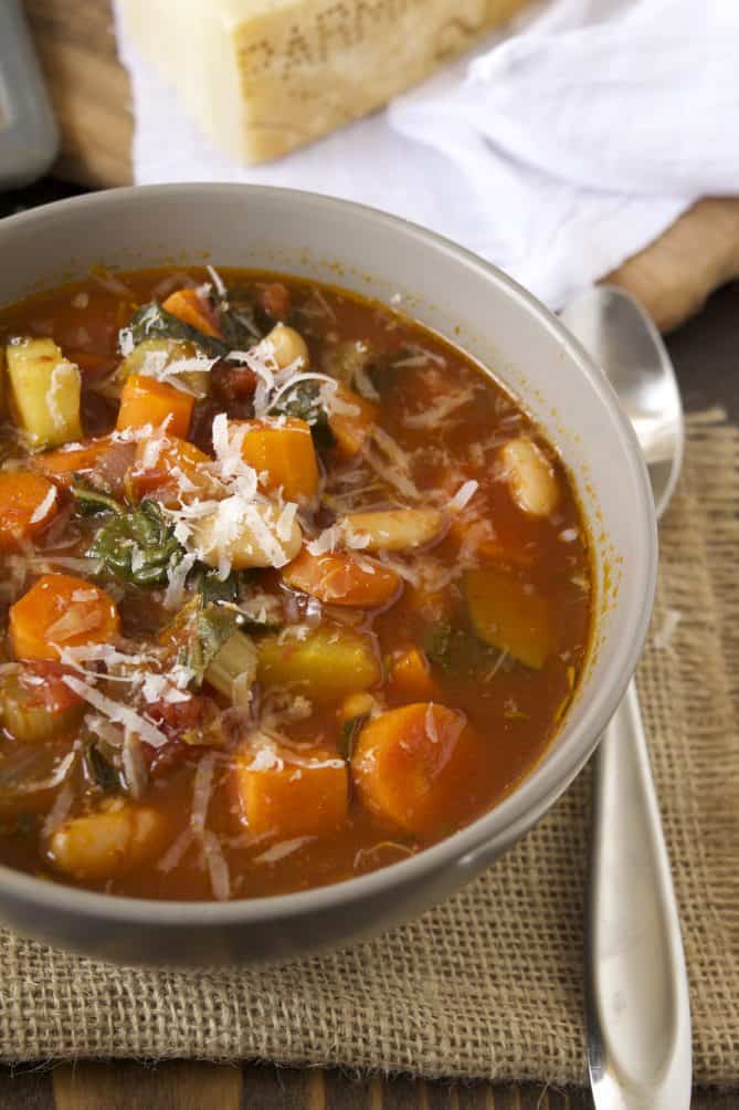A closeup showing the carrots, squash and beans in the soup