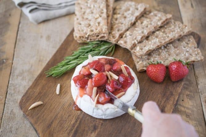 Cutting into the baked brie