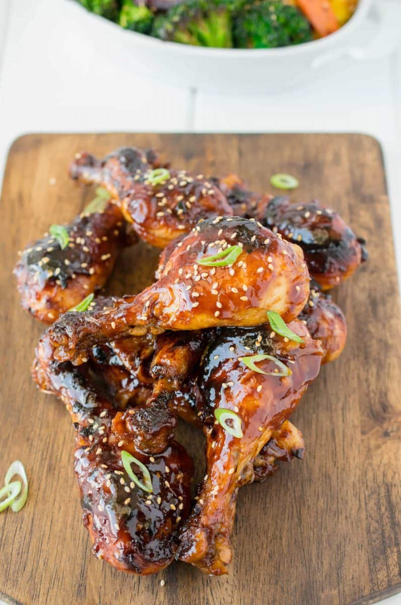 Drumsticks piled up on a wooden board