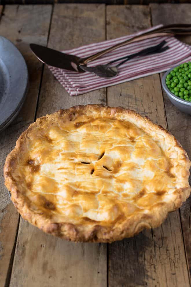 The pie fresh out of the oven with perfectly browned pastry