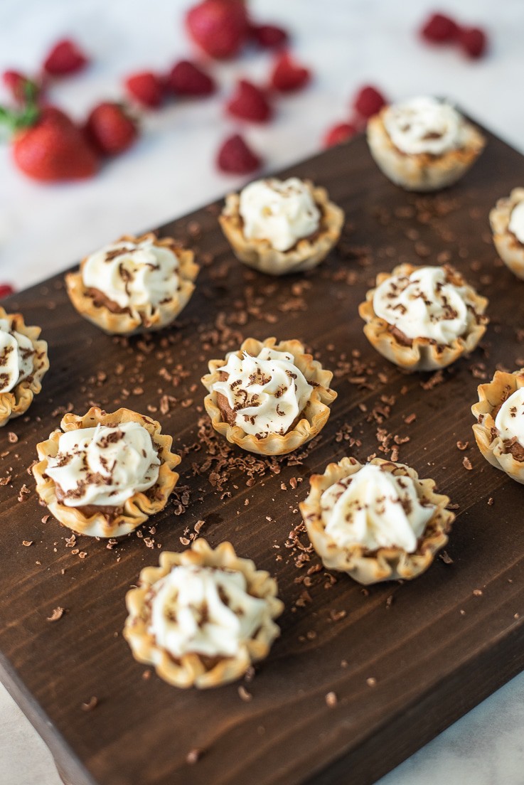 Chocolate mousse and vanilla phyllo dessert cups with shaved chocolate and strawberries