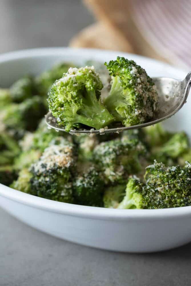 2 broccoli florets on a spoon