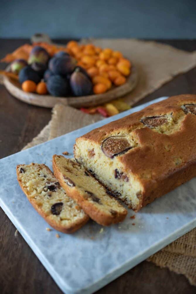 Fig and orange loaf sliced on a board