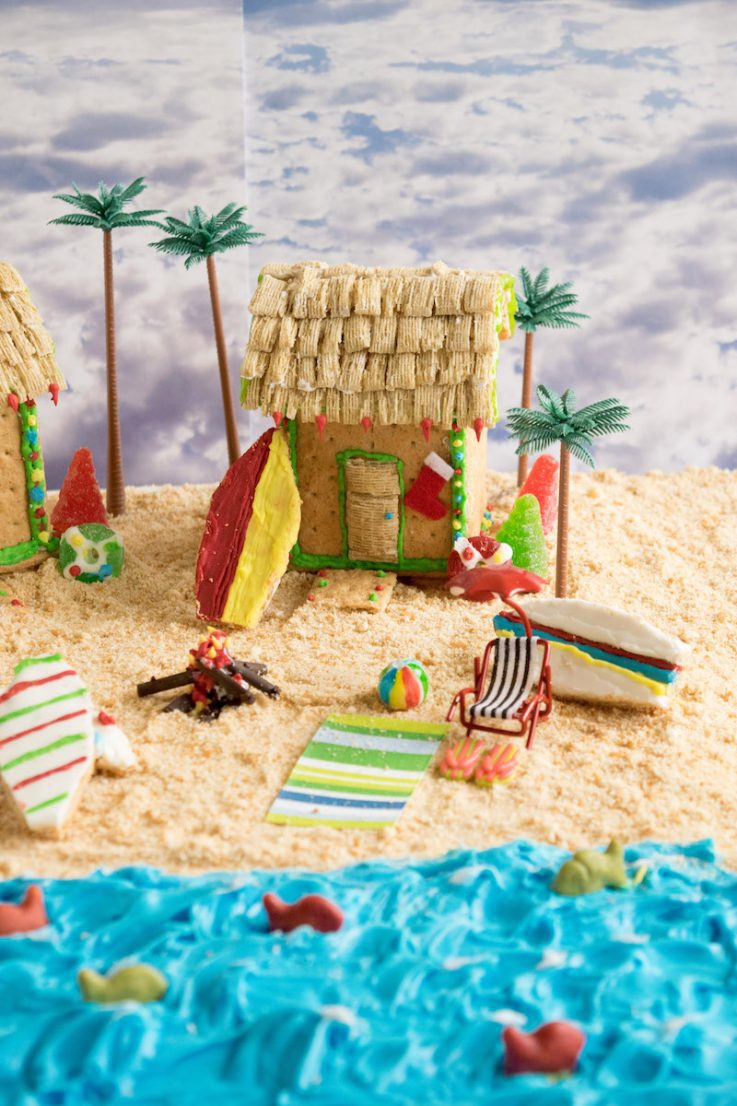 Blue frosing ocean with Goldfish crackers, cookie surfboards and Graham cracker house and sand