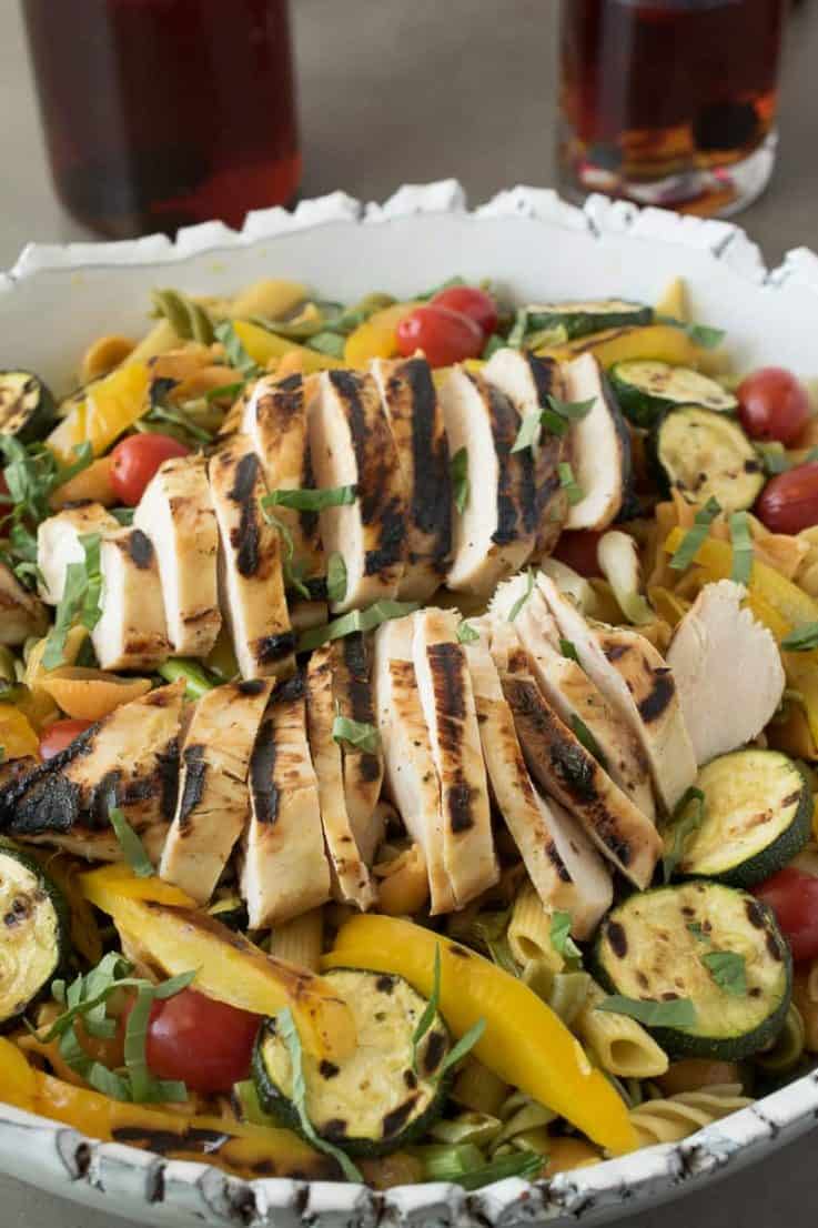 A closeup showing the grilled chicken and colorful vegetables