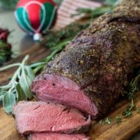 A beef tenderloin with a pink center, sliced