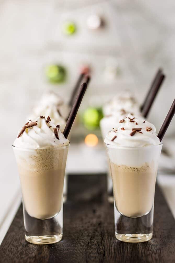 Mini milkshakes lined up on a board