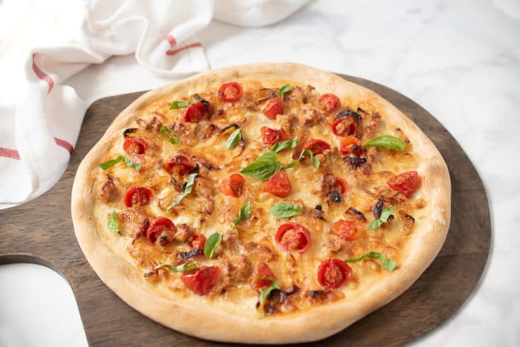 A yeast free pizza on a serving board