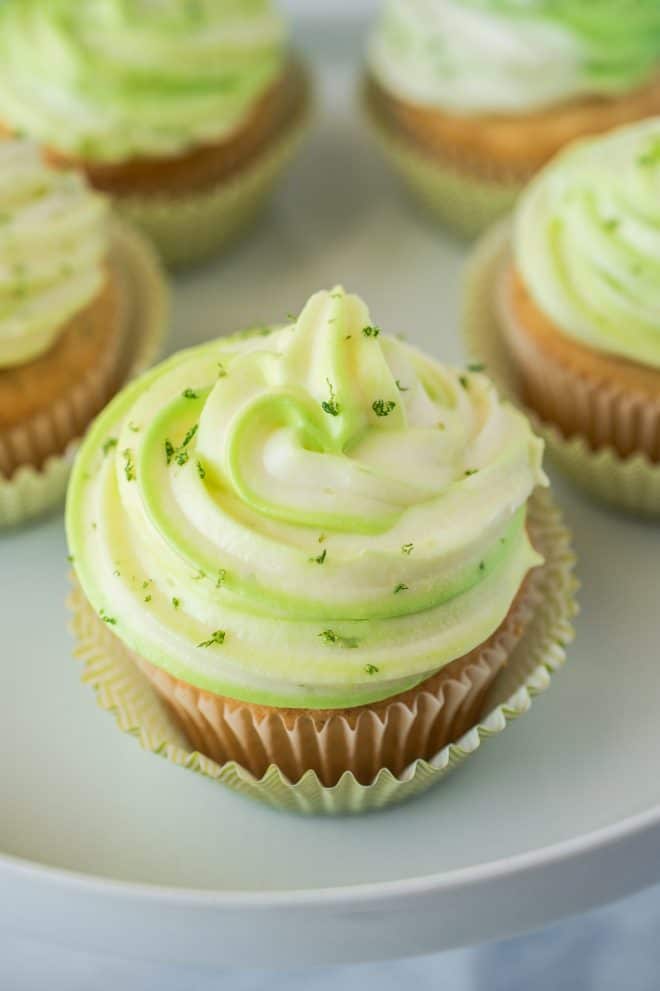 A closeup of the green and white frosting with lime zest