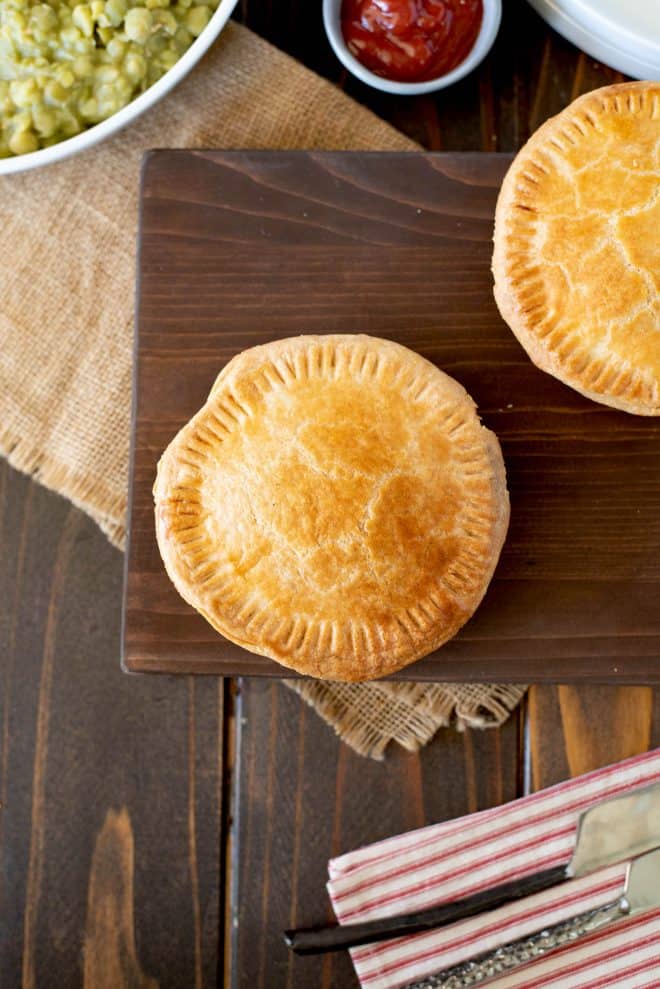 A minced beef and onion pie from overhead showing the golden pastry