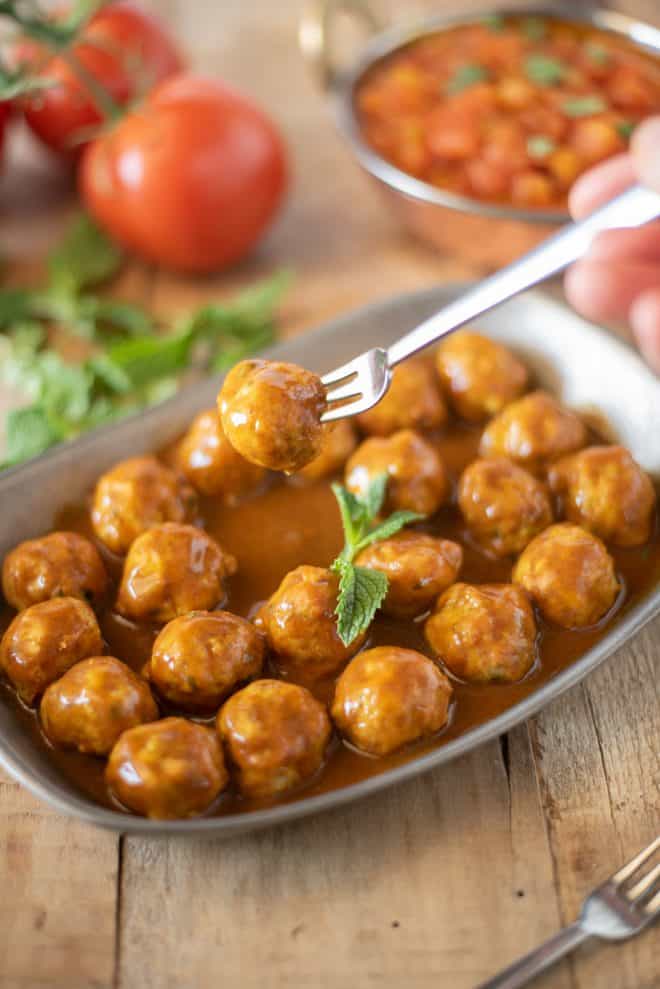 A mini meatball on a fork