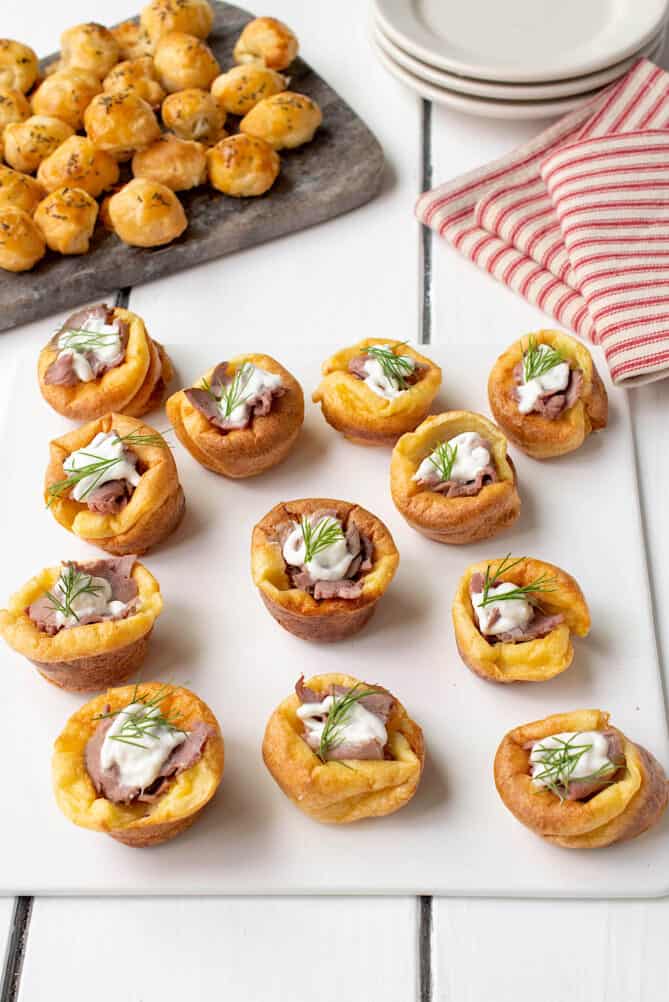 A white platter filled with Yorkshire pudding bites