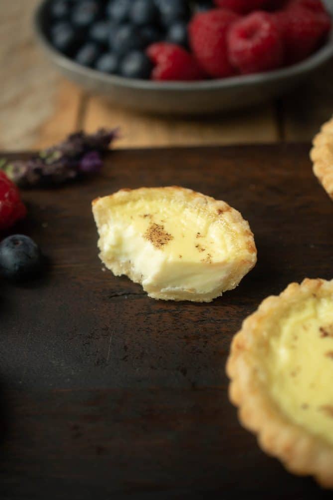 A bite taken out of a custard tart