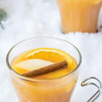 A snowy scene with a glass mug of mulled Pimm's cup