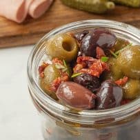 A closeup showing the sweet sun-dried tomatoes and rosemary leaves