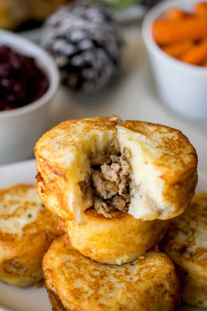 A potato dumpling cut open showing the sausage inside