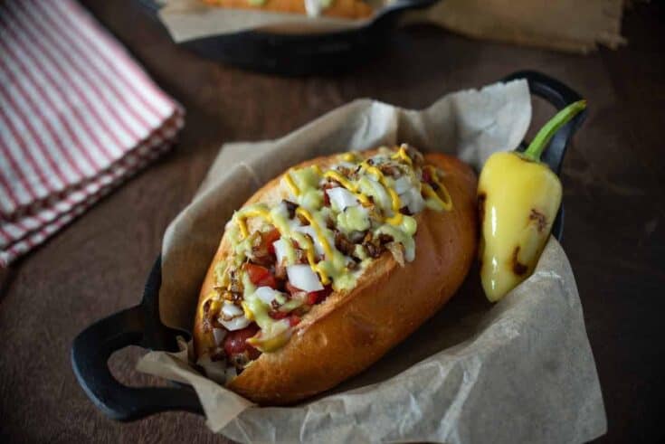 A Southwest Sonoran hot dog in a black bowl
