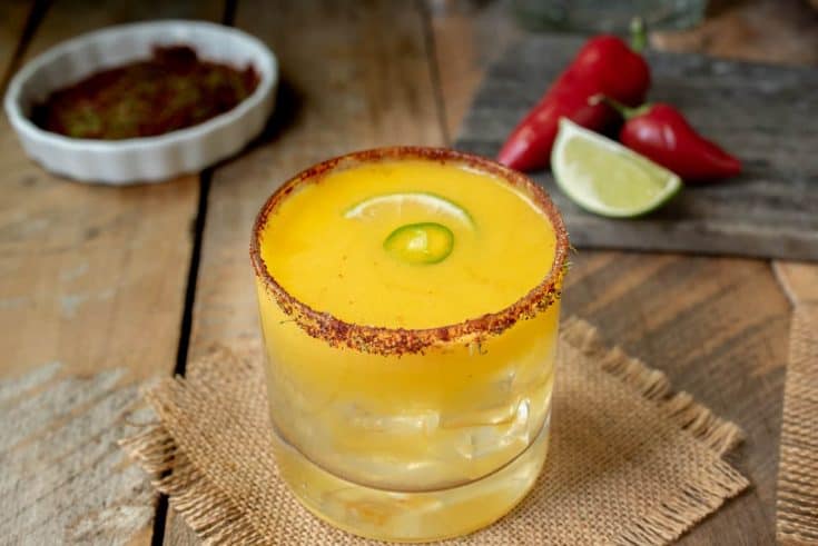 Spicy Jalapeño Mango Margarita with chili peppers and lime