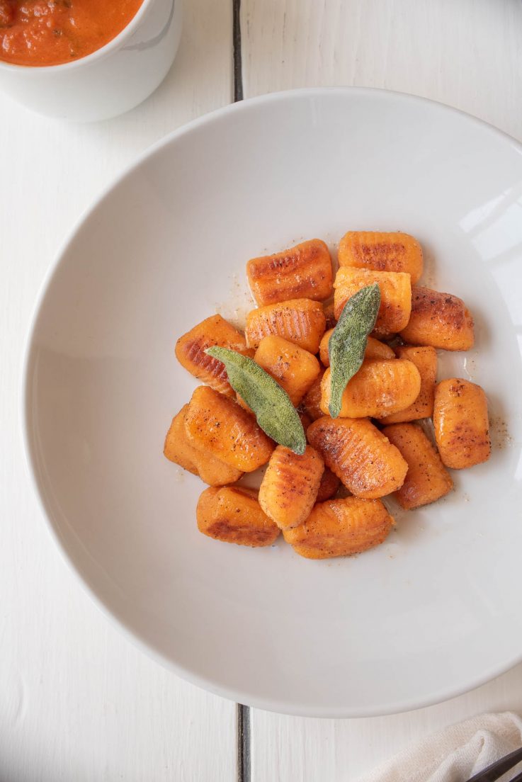 A closeup of the gnocchi showing the crispy browning and sage