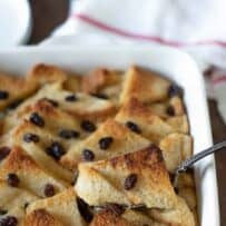 Scooping out a slice of bread pudding