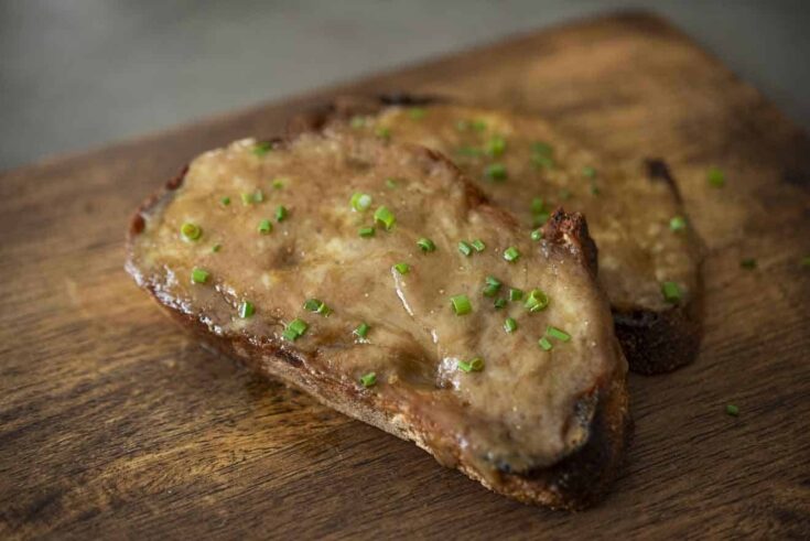 Melted cheese sauce on sliced bread
