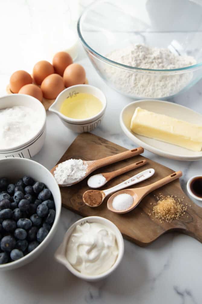 Teaspoon and tablespoon measuring spoons with flour, eggs and butter. U.S. to Metric Weights and Measures Conversions